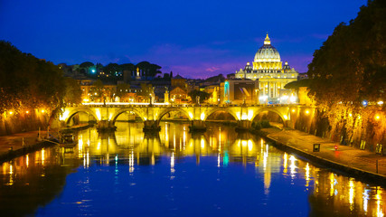 Fototapeta na wymiar River Tiber in Rome with a view over Vatican and St Peters Basilica