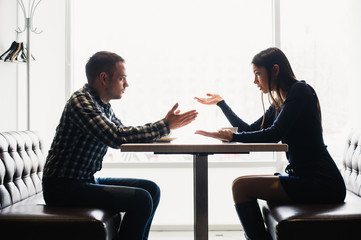 Man and woman in discussions in the restaurant