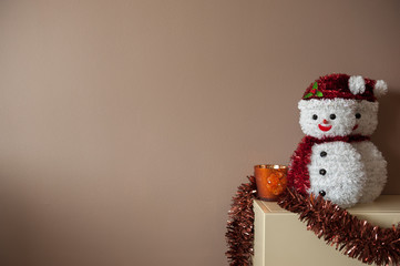 snowman decoration against plane background with negative space