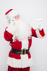 Santa Claus Reading Letter isolated over white baclground
