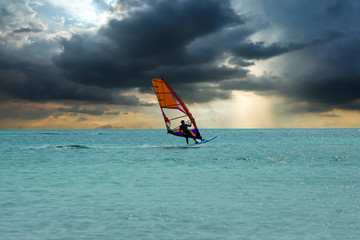 Windsurfer at Aruba island on the Caribbean Sea at a beautiful s