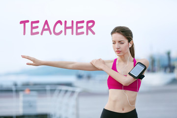 Fototapeta na wymiar Young woman doing exercises on pier. Word TEACHER on background. Sport concept.