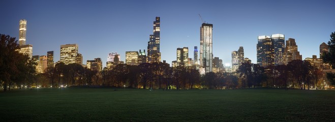 Panorama of buildings along Central park 59th Street at twilight