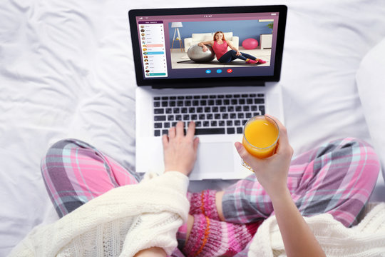 Woman Watching Sport Training Online On Laptop. Fitness And Sport Blog.