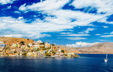 Naklejka premium One small and pretty island Simi with his colourful buildings, near the Rhodes, Greece. Great view on island from the ferry.