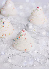 Christmas decoration edible - meringue Christmas tree, creative food idea for kids party, bokeh background