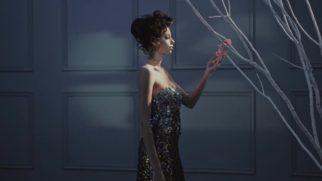 Pretty mother holding a bootle of perfume