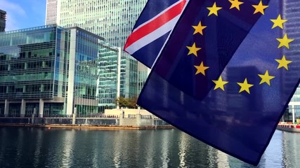 European Union and Union Jack flags flying above the River Thames in London, UK - Powered by Adobe