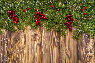 Christmas fir tree on wooden background