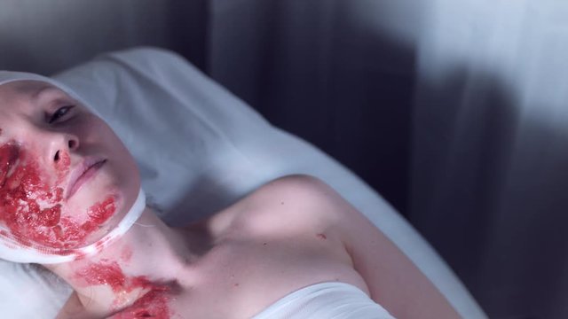 4k Hospital Shot of Injured Woman Looking at Camera, dolly shot