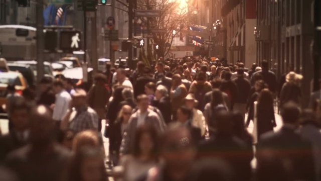 View of people walking on crowd sidewalk in Manhattan. New York, USA.