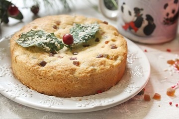 Christmas cake with candied dry fruits, selective focus