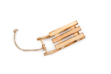 Brown wooden sled with jute cord,isolated on white background.Winter,Christmas, New Year wooden...