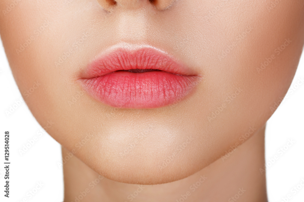 Wall mural Perfect natural lip makeup. Close up macro photo with beautiful female mouth. Plump full lips. Close-up face detail. Perfect clean skin, light fresh lip make-up. Beautiful spa tender lip