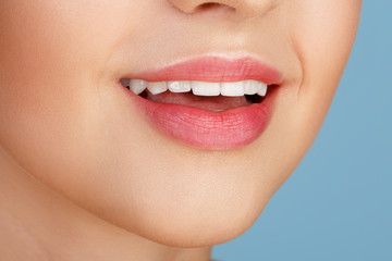 Perfect natural lip makeup. Close up macro photo with beautiful female mouth. Plump full lips. Close-up face detail. Perfect clean skin, light fresh lip make-up. Beautiful spa tender lip