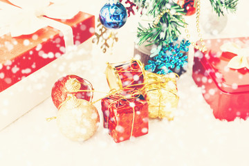 Gift boxes and decorated christmas  with snow