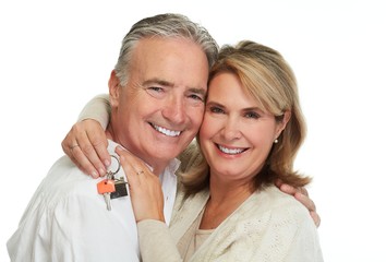 Senior couple with house key.
