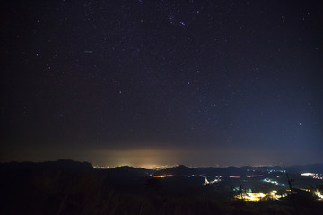 Geminid Meteor in the night sky over Wat Phra That Pha Son Kaew