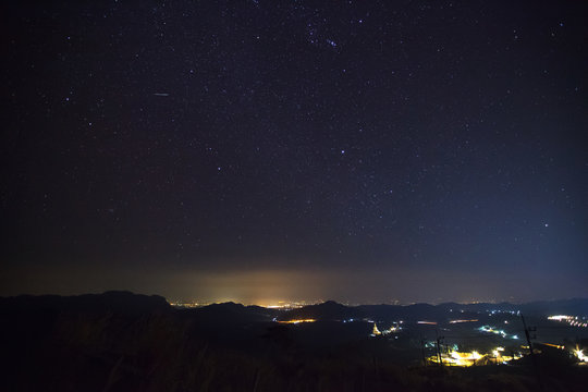 Geminid Meteor in the night sky over Wat Phra That Pha Son Kaew