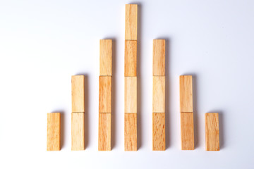 Bar graph made from wooden blocks . Business concept.