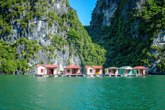 A small fishing village floats in a cove in Ha Long Bay, Vietnam.