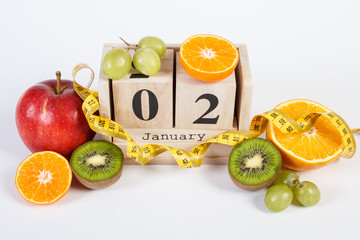 Cube calendar, fruits and tape measure, new years resolutions