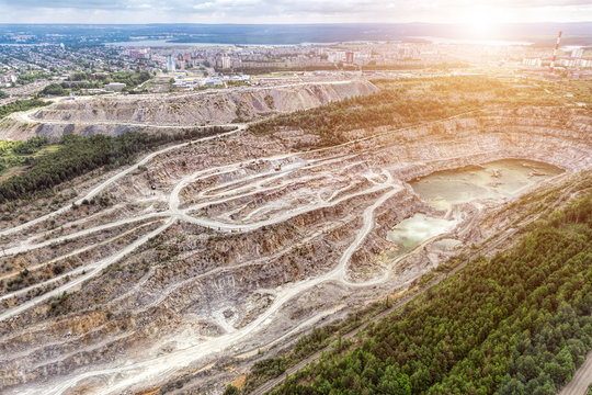 Open quarry for stone extraction. Quarry. Panorama aerial view.