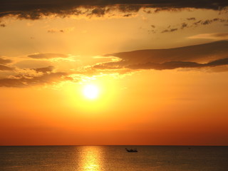 Fishing boats pull their nets at the sunrise. Adriatic cost. Emilia Romagna. Italy.
