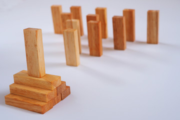 Close up of wood block stacking as step stair with planning in business model ladder success.