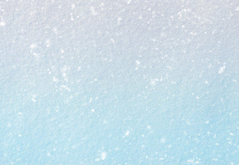 background of fresh snow texture in blue tone with snowfall effe