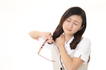 肩こりを訴えるビジネスウーマン