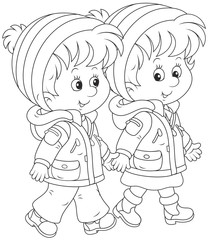 Friendly smiling children walking and talking together