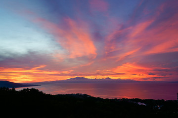 colorfull sunset behind mountains of tropical island Siqijor