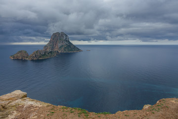 Fototapeta na wymiar Clouds over the mysterious island of Es Vedra