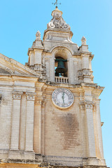Old bell tower under blue sky