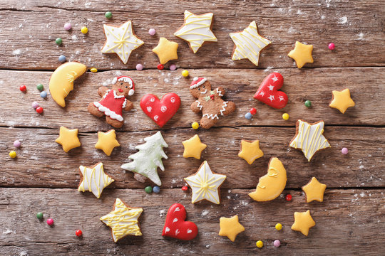 Various Christmas gingerbread on a wooden background. horizontal top view 