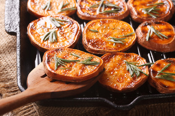Roasted sweet potatoes on a grill pan macro. horizontal