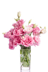 bunch of pink eustoma flowers in glass vase