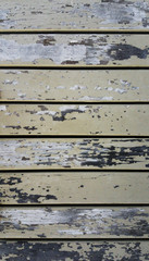 Wood plank fence with an old color close up.