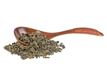 Dry green tea in wooden spoon isolated on white background
