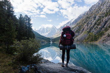 Hikers with backpacks enjoying valley view