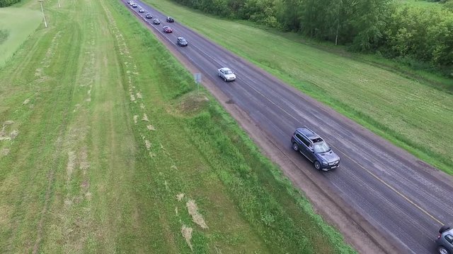 Driving car on asphalt road. Aerial view.