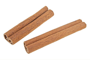 Two cinnamon sticks isolated on white background