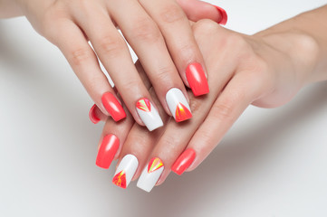 Festive manicure orange white with elements of broken glass