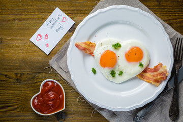 Valentine's day breakfast - eggs, bacon, ketchup
