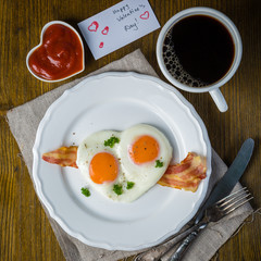 Valentine's day breakfast - eggs, bacon, ketchup