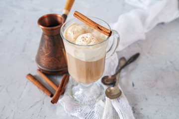 coffee with ice cream in a glass on a table, selective focus