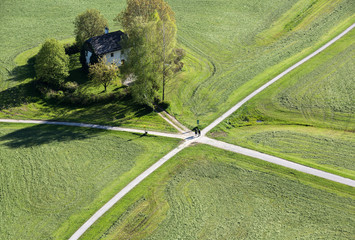 Aerial panoramic view from the top of Hohensalzburg fortress (Castle) on cultivated land divided by the crossing ways (roads). Salzburg, Austria