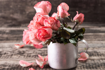 Romantic floral frame background Valentines day background Pink roses on wooden background