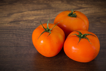 Fresh tomatoes on the table. (low key tone)